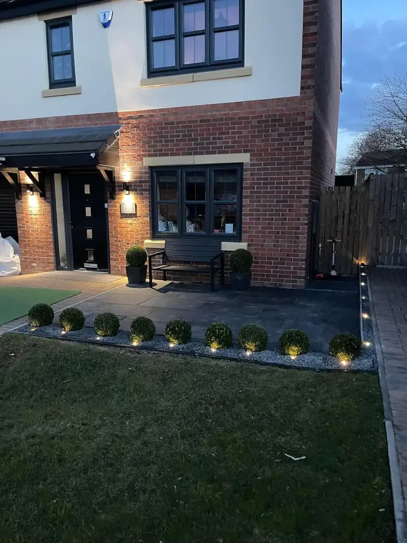 Front garden landscape with slabbed path & lighting