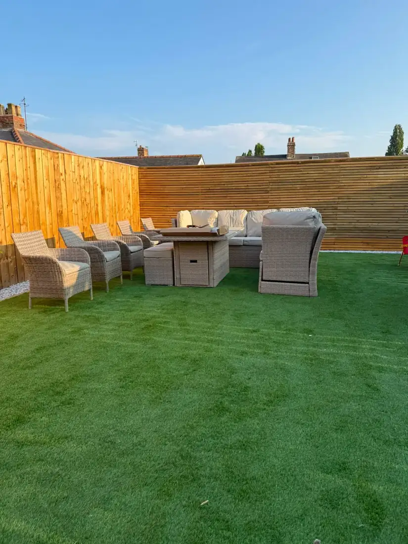Garden makeover with fresh lawn & rattan seating area